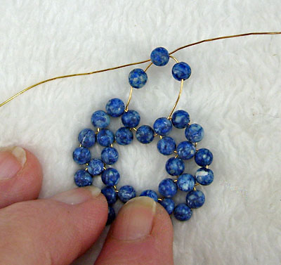 Earrings of round beads