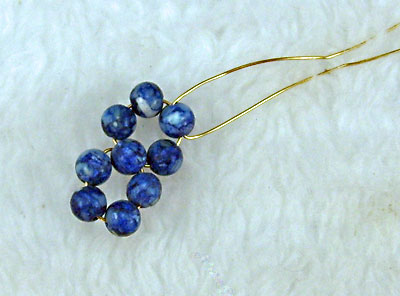 Earrings of round beads