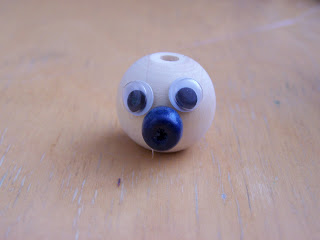 Funny figures made of wooden beads