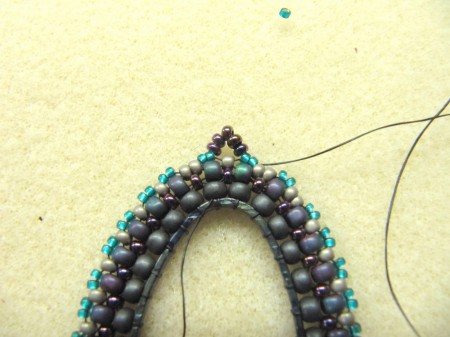 Oval beaded pendant