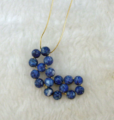 Earrings of round beads