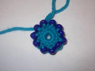Hook and beads. Knit flower
