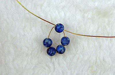 Earrings of round beads