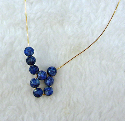 Earrings of round beads