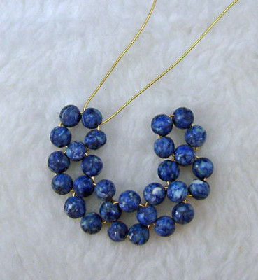 Earrings of round beads