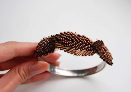 Beaded bracelet on a metal base