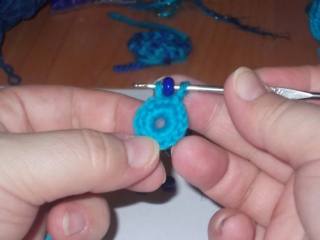 Hook and beads. Knit flower