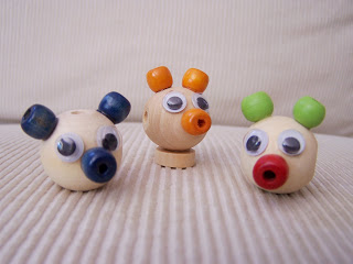 Funny figures made of wooden beads
