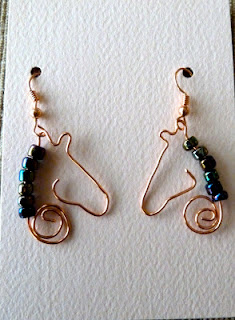 Fashionable earrings in the form of a horse's head